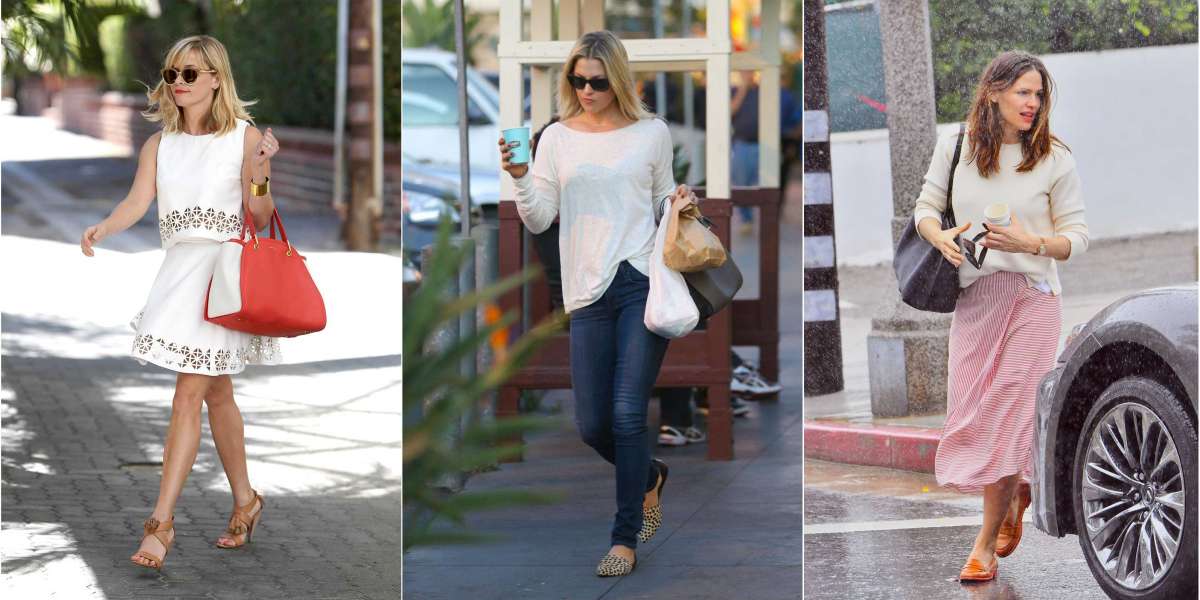a short sleeve denim Balenciaga top pd with flare high rise jeans
